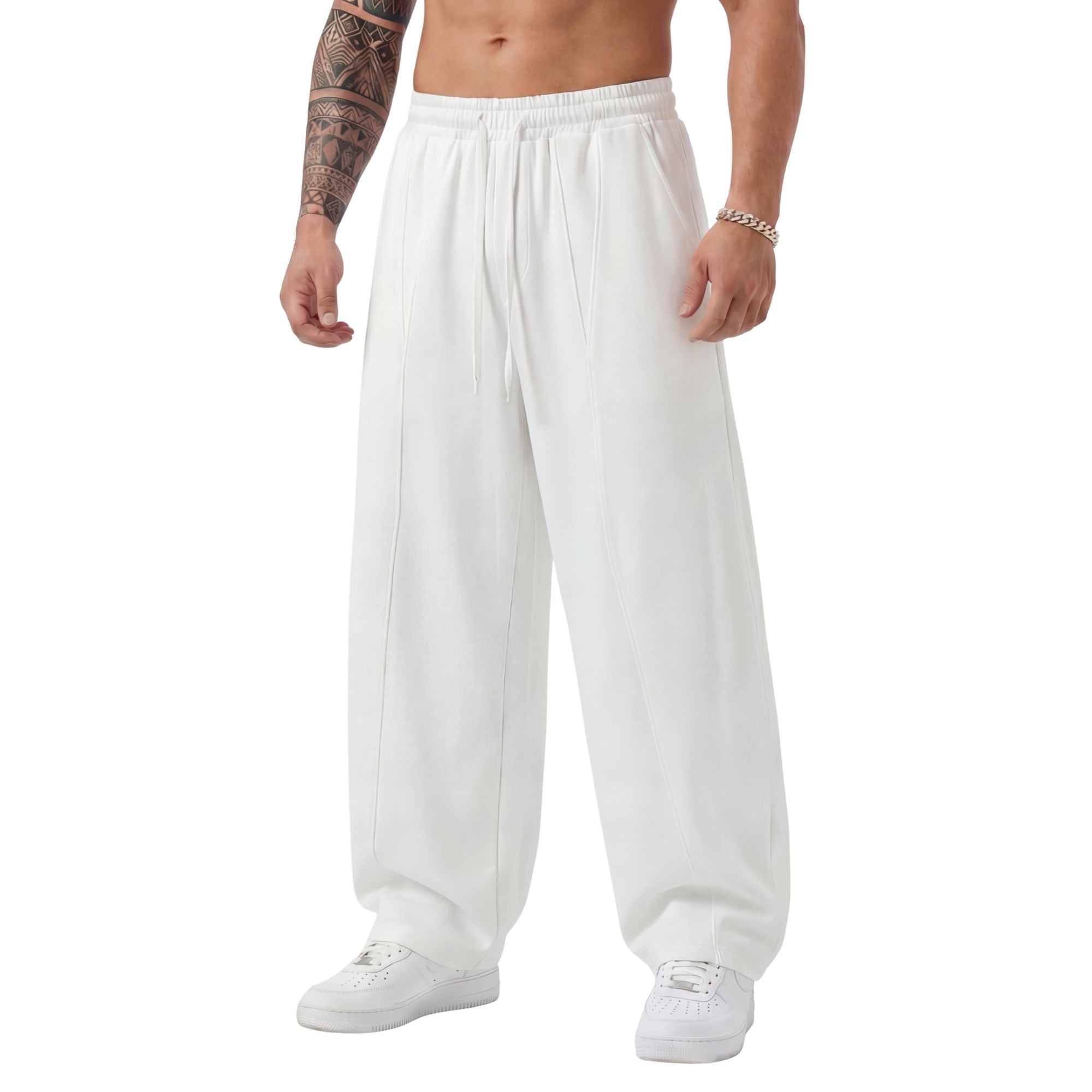 White sweatpants worn by a person on a white background